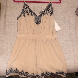 Embroidered romper with open back detail